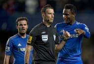 A picture taken on October 28, 2012 shows Chelsea's Nigerian midfielder John Mikel Obi (R) talking with referee Mark Clattenburg (2nd R) as Spanish midfielder Juan Mata (L) looks on during the English Premier League football match between Chelsea and Manchester United at Stamford Bridge in London. London's Metropolitan Police have confirmed that they have received a complaint about allegedly racist comments made by a top flight referee during last weekend's match between Chelsea and Manchester United. Clattenburg is alleged to have used "inappropriate language", reportedly of a racist nature, towards Chelsea's Nigerian and Spanish players John Mikel Obi and Juan Mata at Stamford Bridge on October 28, 2012. AFP PHOTO/ADRIAN DENNISRESTRICTED TO EDITORIAL USE. No use with unauthorized audio, video, data, fixture lists, club/league logos or 'live' services. Online in-match use limited to 45 images, no video emulation. No use in betting, games or single club/league/player publications. (Photo credit should read ADRIAN DENNIS/AFP/Getty Images)
